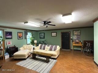 living room with tile patterned floors, ceiling fan, and a healthy amount of sunlight