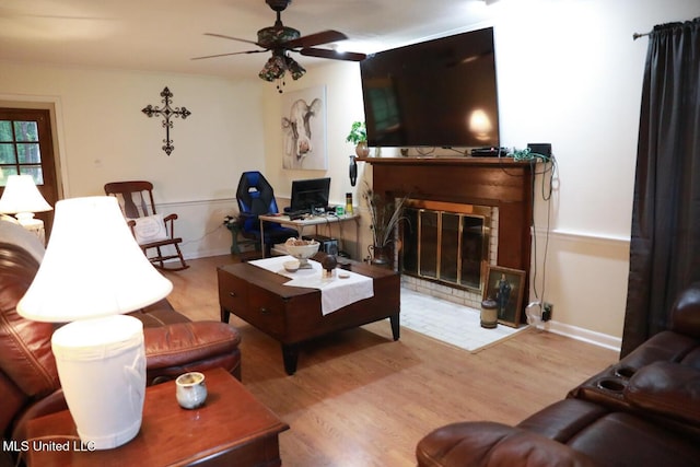 177 Robbins Rd, Brandon, MS 39042 - living area with wood finished floors, a ceiling fan, and a glass covered fireplace