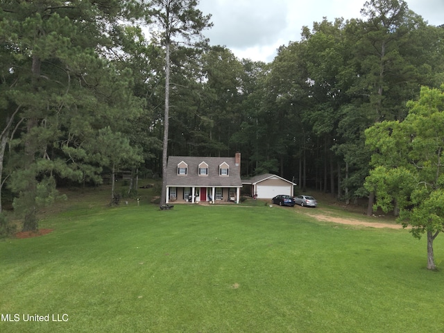 177 Robbins Rd, Brandon, MS 39042 - new england style home featuring covered porch, a front lawn, a chimney, and a garage