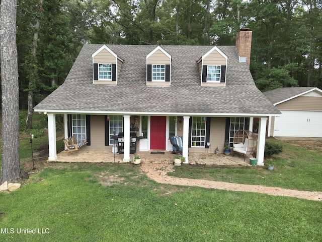 177 Robbins Rd, Brandon, MS 39042 - new england style home with roof with shingles, a chimney, a porch, a front yard, and an outbuilding