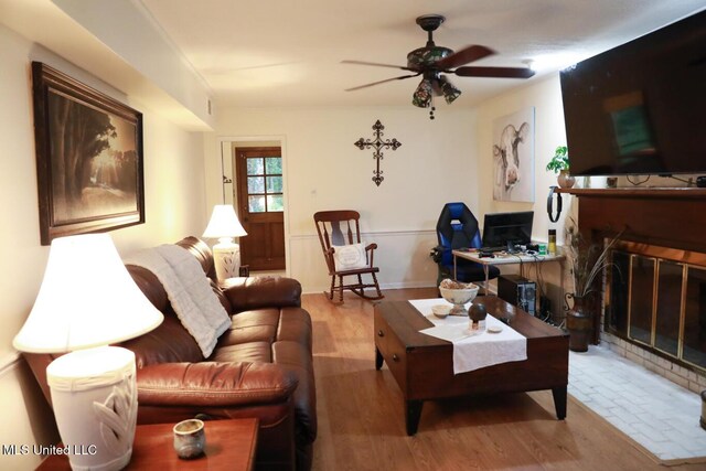 177 Robbins Rd, Brandon, MS 39042 - living area featuring wood finished floors, ceiling fan, and a glass covered fireplace