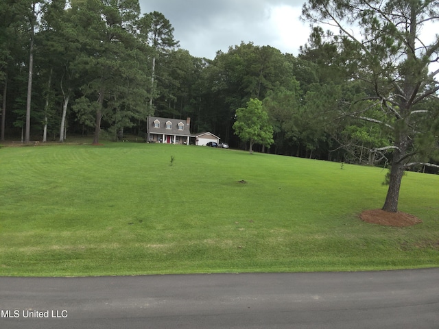 177 Robbins Rd, Brandon, MS 39042 - view of home's community featuring a lawn and a wooded view