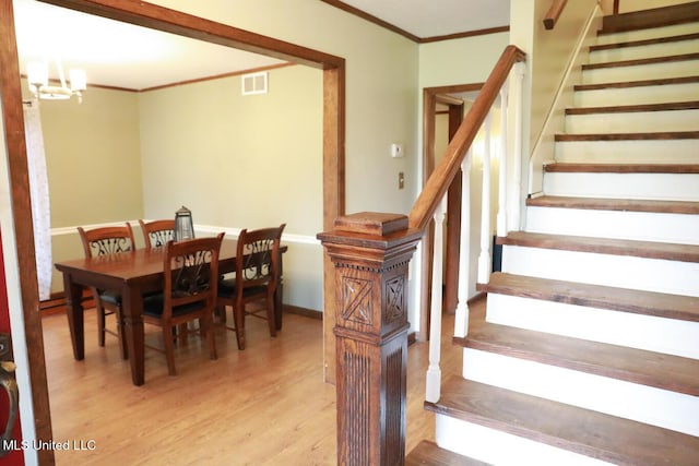 177 Robbins Rd, Brandon, MS 39042 - dining area with ornamental molding, light wood finished floors, stairway, and a chandelier