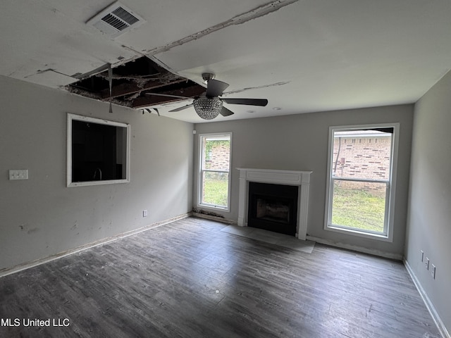 111B N Bent Creek Cir, Brandon, MS 39047 - unfurnished living room with wood finished floors, a fireplace with flush hearth, baseboards, and a ceiling fan