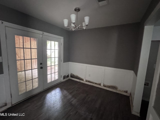 111B N Bent Creek Cir, Brandon, MS 39047 - unfurnished dining area with french doors, a chandelier, dark wood-type flooring, and wainscoting