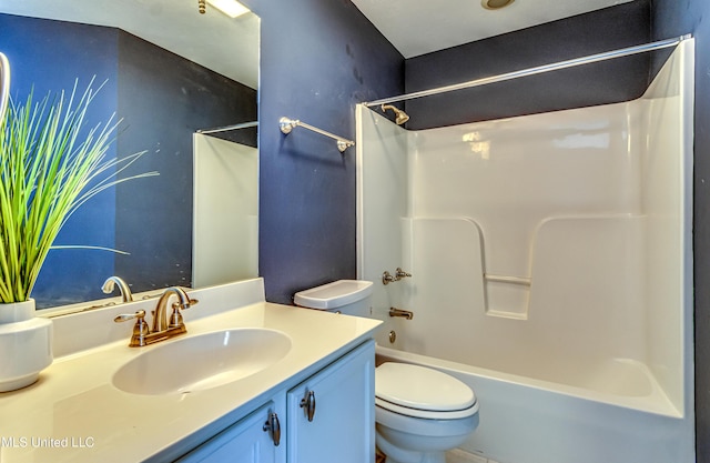 bathroom featuring  shower combination, vanity, and toilet