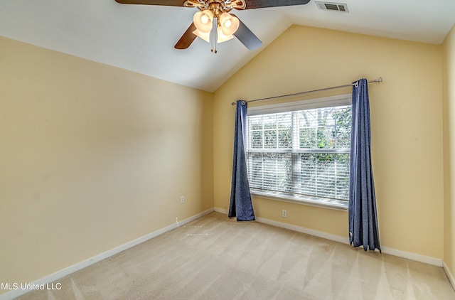 unfurnished room featuring vaulted ceiling, carpet flooring, visible vents, and baseboards