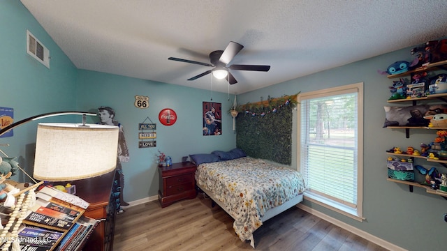 3902 S Windermere Dr, Nesbit, MS 38651 - bedroom featuring wood finished floors, baseboards, a ceiling fan, and a textured ceiling