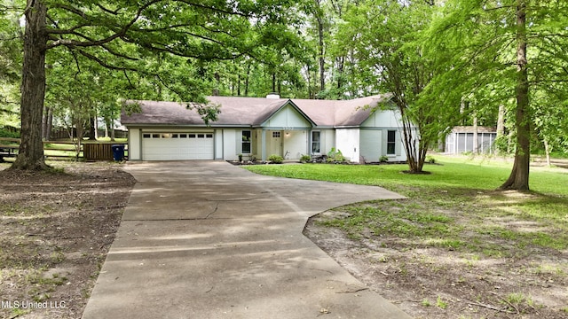 3902 S Windermere Dr, Nesbit, MS 38651 - ranch-style home with concrete driveway and an attached garage