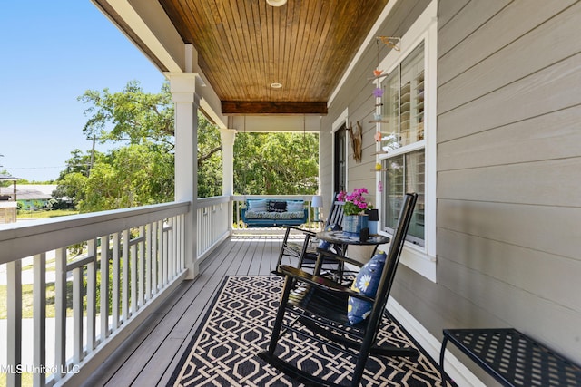wooden deck with a porch
