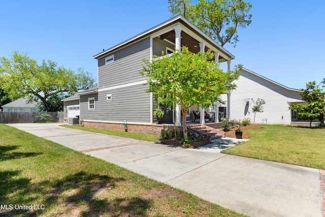 view of front facade featuring concrete driveway, an attached garage, and central air condition unit