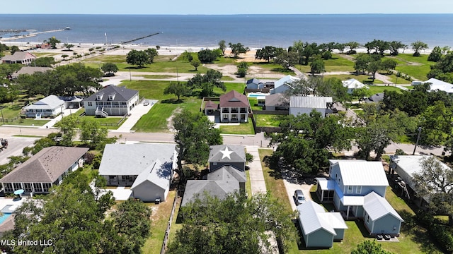 aerial perspective of suburban area featuring a large body of water