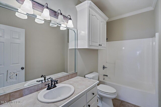 full bath with crown molding, shower / bath combination, toilet, vanity, and tile patterned flooring