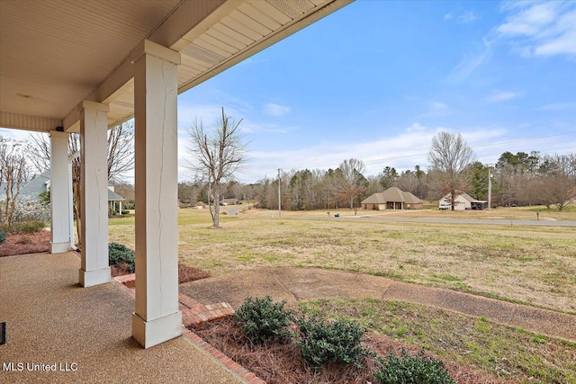 view of yard with covered porch