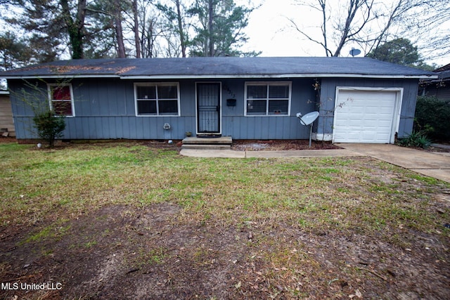 ranch-style house featuring a garage and a front yard