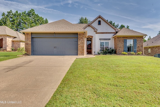 513 Willow Valley Cir, Brandon, MS 39047 - traditional home featuring an attached garage, concrete driveway, a front yard, and brick siding