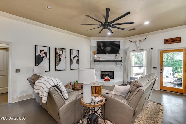 513 Willow Valley Cir, Brandon, MS 39047 - living area with ornamental molding, finished concrete flooring, a ceiling fan, recessed lighting, and a fireplace