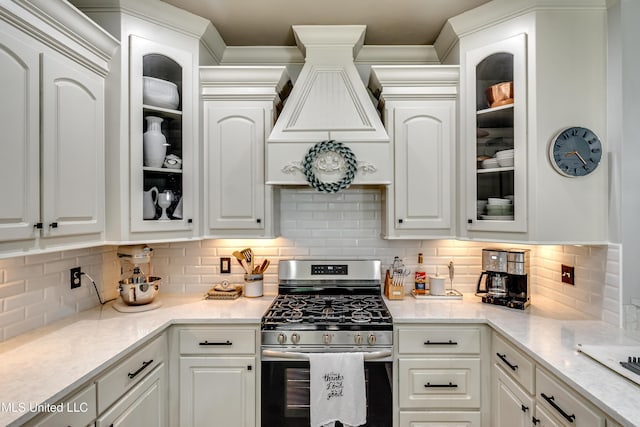 513 Willow Valley Cir, Brandon, MS 39047 - kitchen featuring stainless steel gas range oven, custom range hood, and white cabinetry