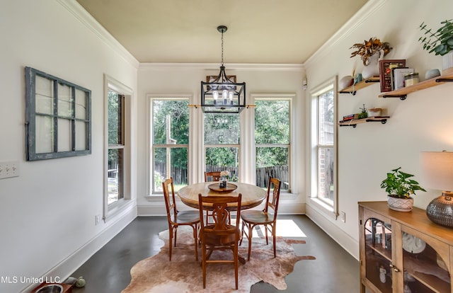 513 Willow Valley Cir, Brandon, MS 39047 - dining room with a chandelier, concrete floors, and crown molding
