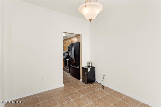 spare room featuring crown molding