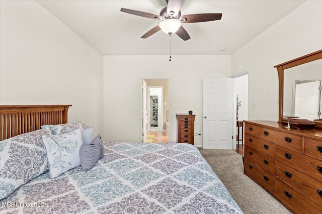 bedroom featuring ceiling fan and light carpet