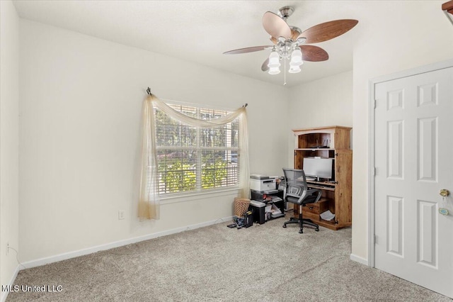 home office featuring ceiling fan and light carpet