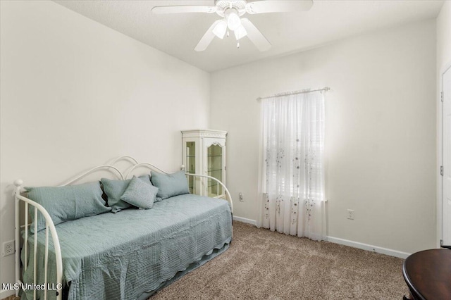 bedroom featuring light colored carpet and ceiling fan