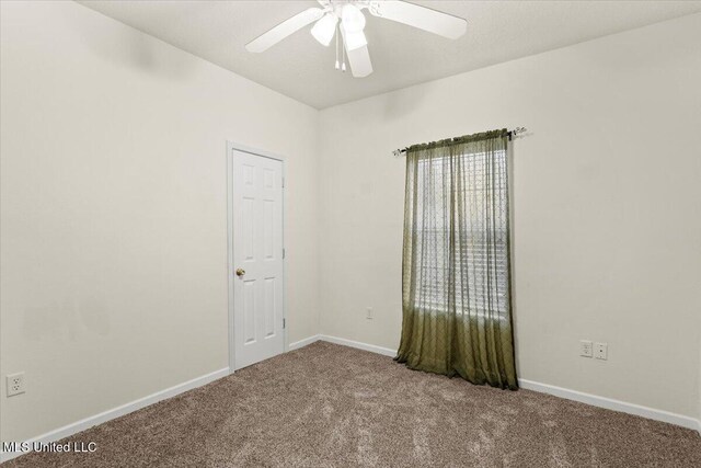 carpeted empty room with ceiling fan