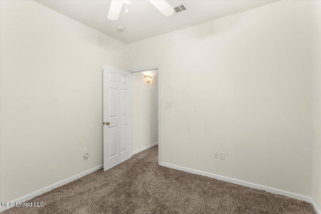 carpeted empty room with ceiling fan