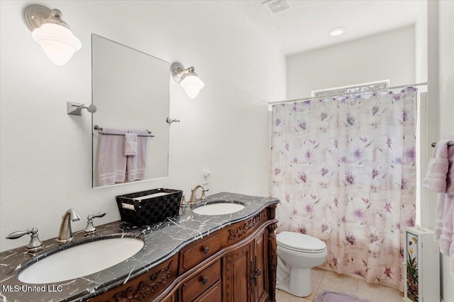 full bathroom featuring tile patterned floors, vanity, toilet, and shower / bathtub combination with curtain