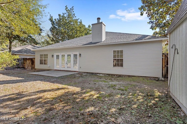 rear view of house with french doors and a patio