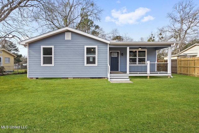 view of front of property with covered porch and a front yard