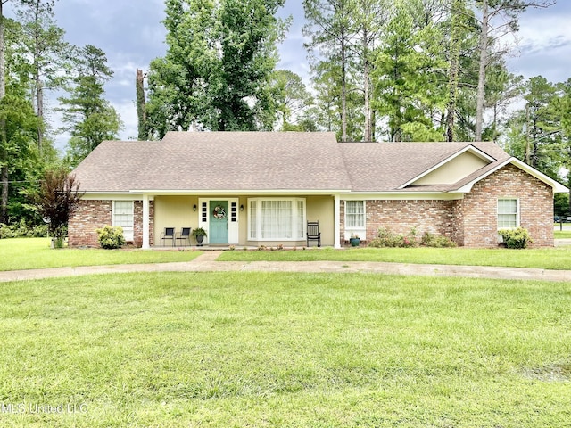 302 Mulberry Ln, Quitman, MS 39355 - single story home with a front lawn, a porch, a shingled roof, and brick siding