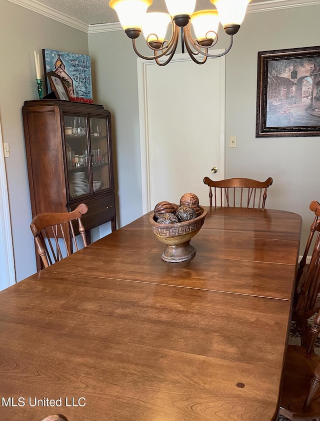 302 Mulberry Ln, Quitman, MS 39355 - dining room featuring a chandelier, crown molding, and a textured ceiling