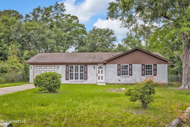 2713 Brazil St, Pascagoula, MS 39581 - ranch-style house featuring fence, a front lawn, concrete driveway, and an attached garage