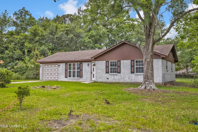 2713 Brazil St, Pascagoula, MS 39581 - ranch-style home featuring fence, a front lawn, brick siding, and an attached garage
