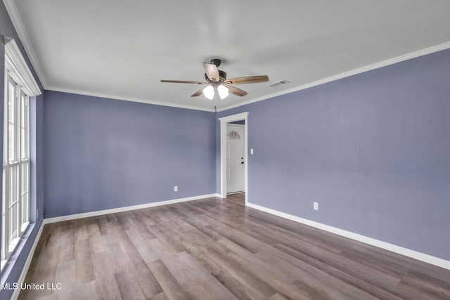 2713 Brazil St, Pascagoula, MS 39581 - empty room featuring crown molding, visible vents, ceiling fan, baseboards, and wood finished floors