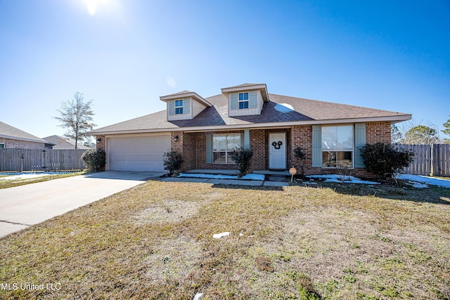 view of front of property with a garage and a front lawn