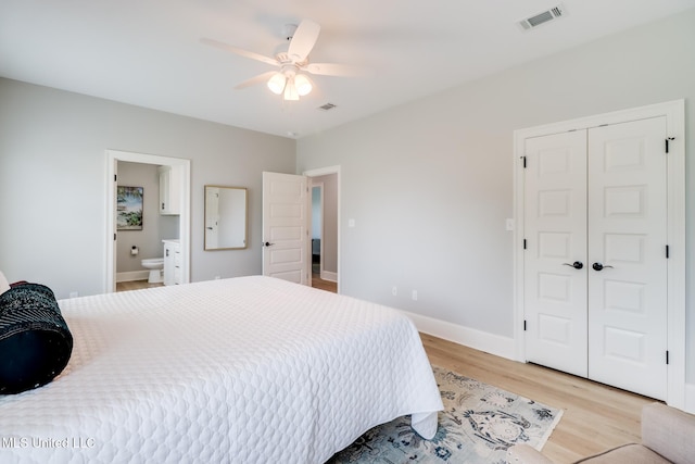 bedroom featuring visible vents, baseboards, a closet, and light wood-type flooring