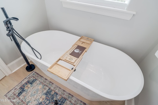 106 Wenmar Ave, Pass Christian, MS 39571 - interior details with a freestanding bath and wood finished floors