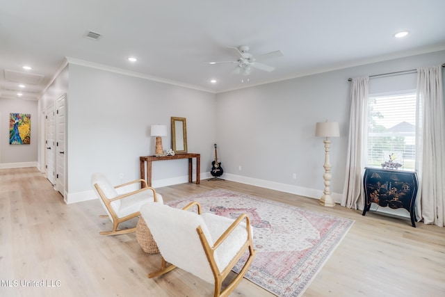 sitting room featuring crown molding, recessed lighting, ceiling fan, and light wood finished floors