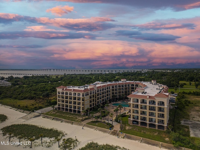 aerial view at dusk with a water view