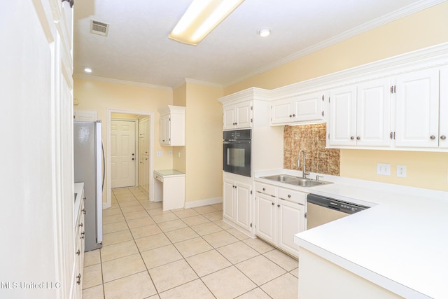 kitchen with white cabinets, appliances with stainless steel finishes, ornamental molding, and sink