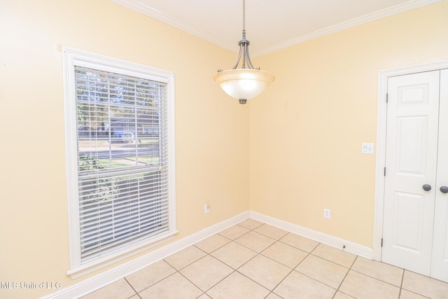 unfurnished dining area with ornamental molding and light tile patterned flooring