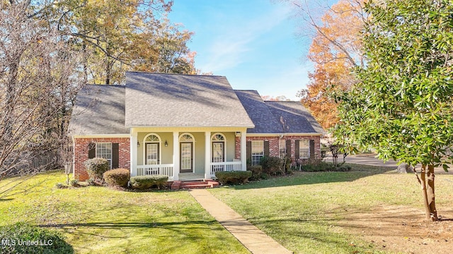 view of front facade with covered porch and a front yard