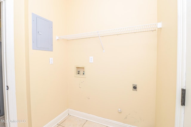 laundry room with gas dryer hookup, electric panel, hookup for a washing machine, hookup for an electric dryer, and light tile patterned flooring