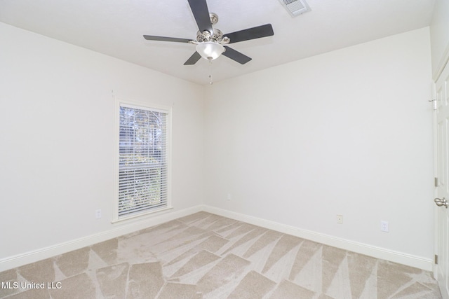 carpeted empty room featuring ceiling fan