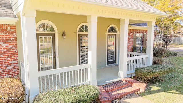 entrance to property featuring a porch