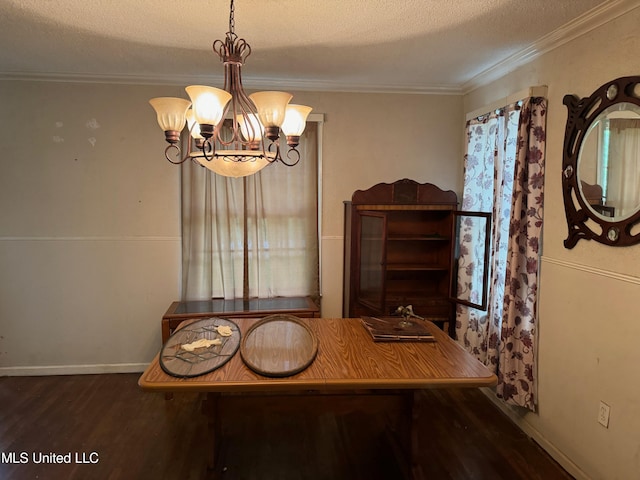 dining area featuring dark wood-type flooring, a notable chandelier, crown molding, and a textured ceiling