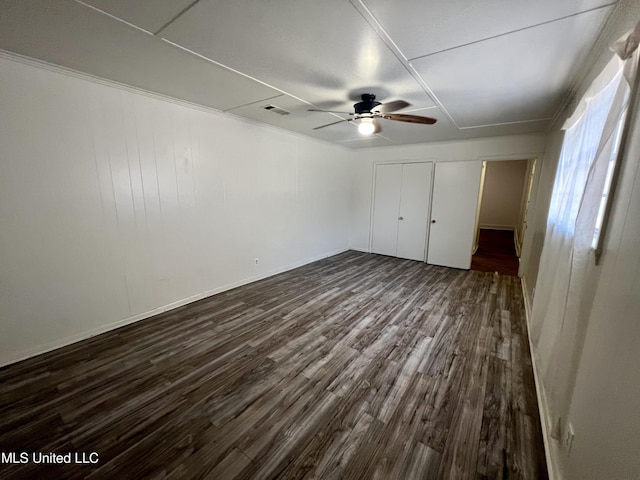 802 Farmer St, Cleveland, MS 38732 - unfurnished bedroom featuring dark wood-style floors and a ceiling fan